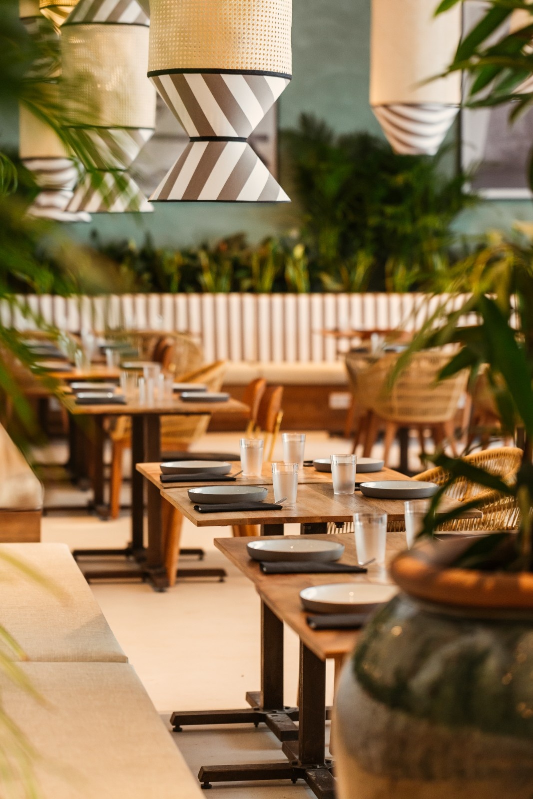outside tables with chairs around it from the restaurant