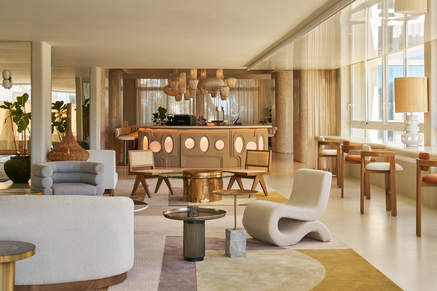 lounge area at Sun & Moon showing a bar in the background with mutliple seats around it