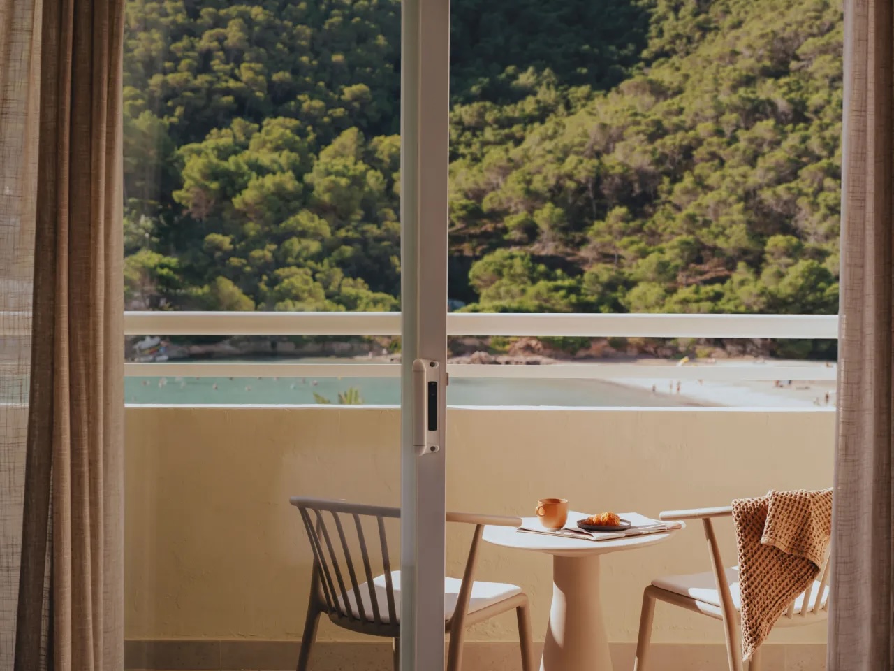 image of balcony with two chairs and a table
