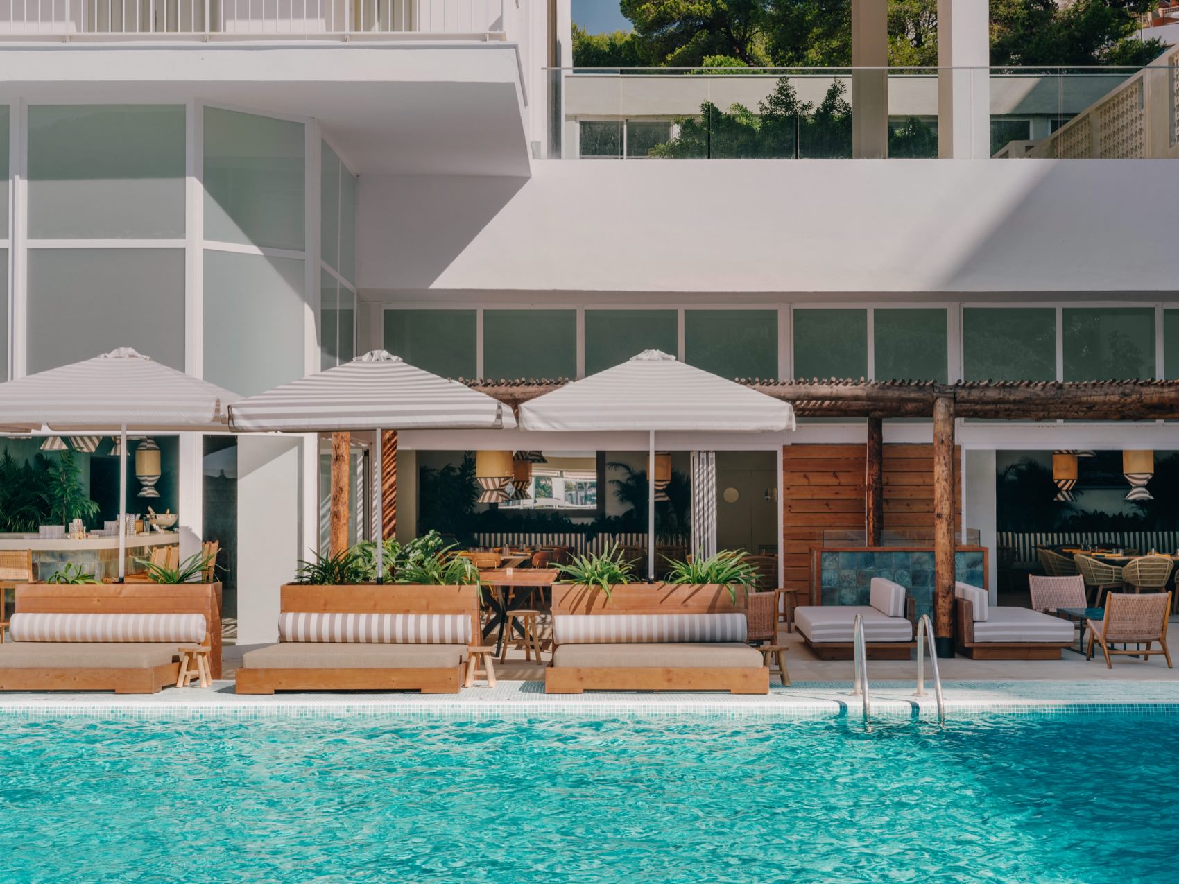 Pool with Bali sunbeds showing the in background
