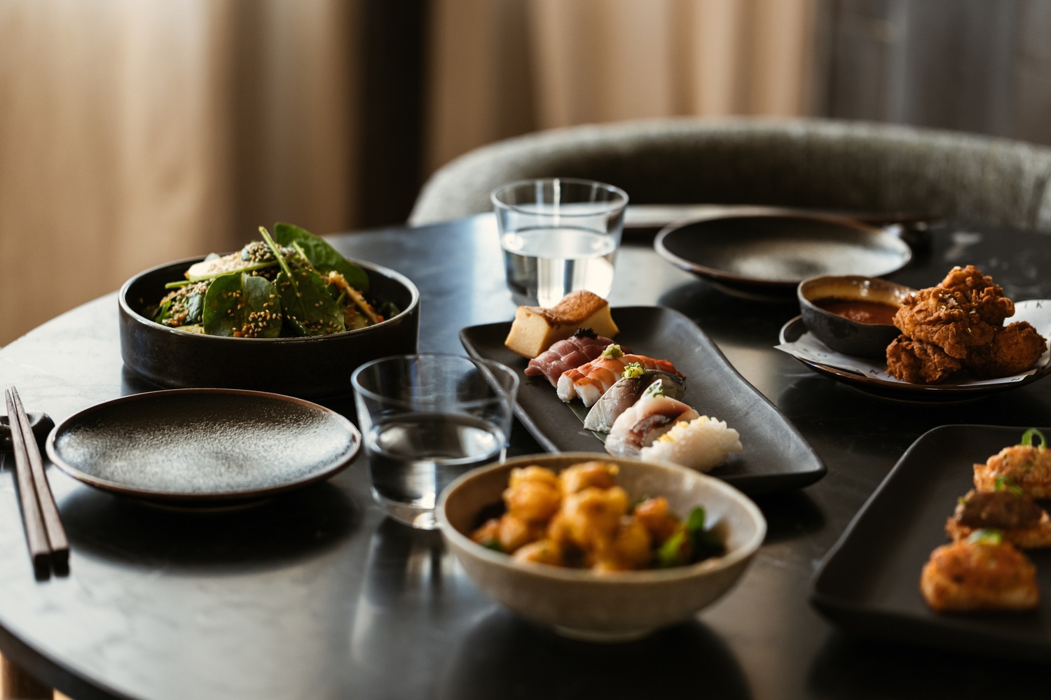 multiple dishes from the Niko restaurant on table