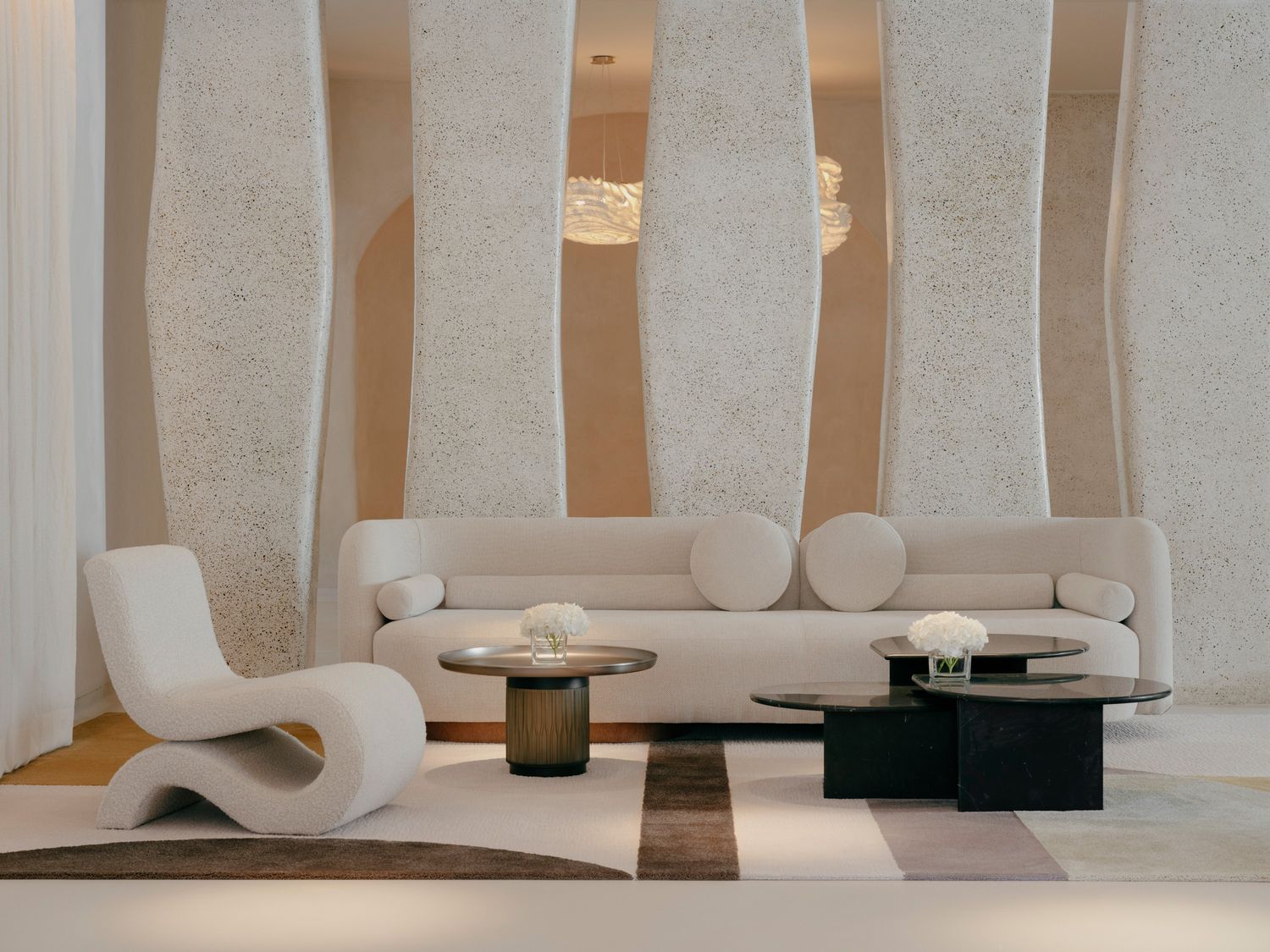 lounge area of the restaurant with a couple of low couches showing and some side tables